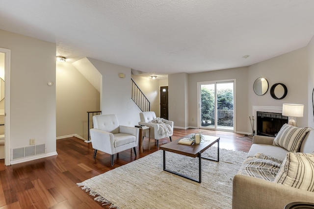 2356 Gavinley Way, Columbus, OH 43220 - living room featuring stairway, a fireplace, wood finished floors, and baseboards
