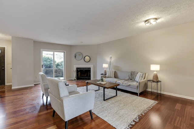 2356 Gavinley Way, Columbus, OH 43220 - living area featuring a fireplace with flush hearth, wood finished floors, and baseboards