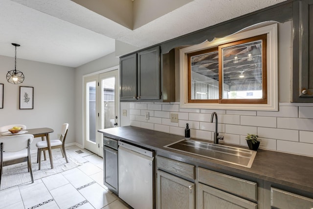 2356 Gavinley Way, Columbus, OH 43220 - kitchen with white dishwasher, a sink, dark countertops, and decorative backsplash