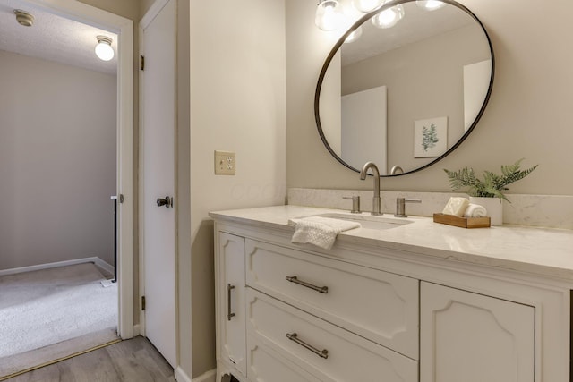 2356 Gavinley Way, Columbus, OH 43220 - bathroom featuring vanity, wood finished floors, and baseboards
