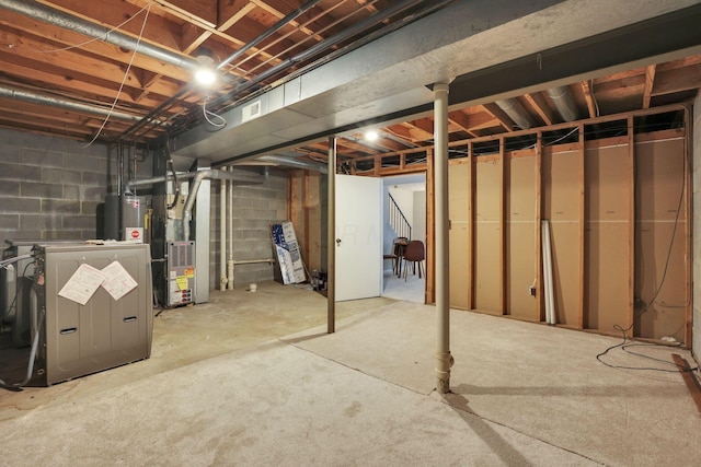 2356 Gavinley Way, Columbus, OH 43220 - unfinished below grade area featuring heating unit and concrete block wall