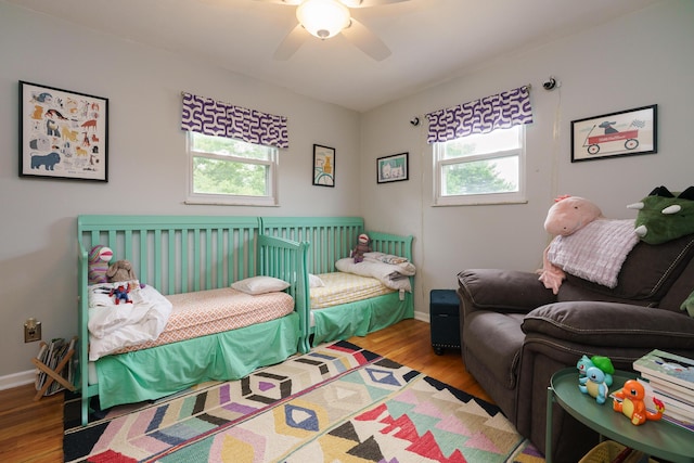 1108 Langland Dr, Columbus, OH 43220 - bedroom with multiple windows, wood finished floors, baseboards, and ceiling fan