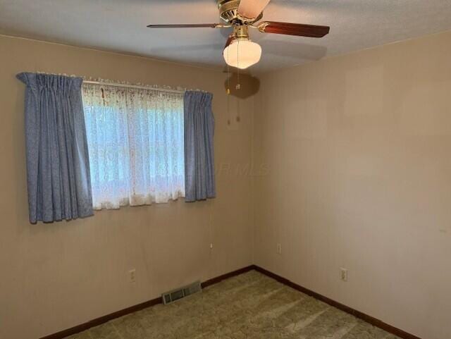 2377 E Howard Rd, Obetz, OH 43207 - carpeted spare room with baseboards and ceiling fan