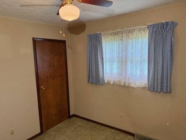 2377 E Howard Rd, Obetz, OH 43207 - empty room with a ceiling fan and carpet flooring