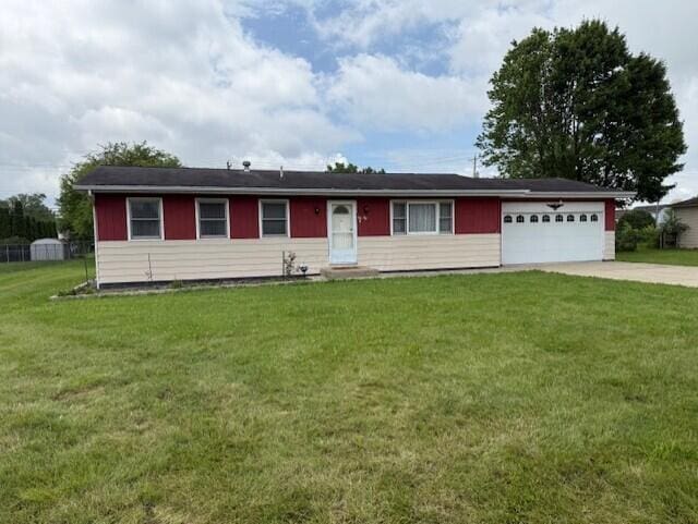 2377 E Howard Rd, Obetz, OH 43207 - single story home featuring driveway, an attached garage, and a front lawn