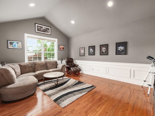 6165 Avocet Ct, Dublin, OH 43017 - living room featuring a wainscoted wall, light wood-type flooring, lofted ceiling, and recessed lighting