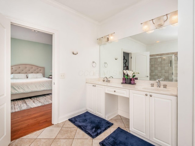 6165 Avocet Ct, Dublin, OH 43017 - ensuite bathroom featuring tile patterned flooring, double vanity, crown molding, and tiled shower