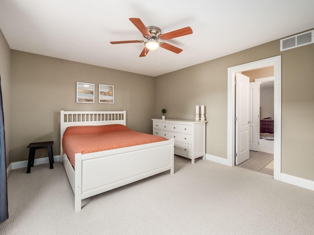 6165 Avocet Ct, Dublin, OH 43017 - bedroom with light carpet, ensuite bathroom, and a ceiling fan