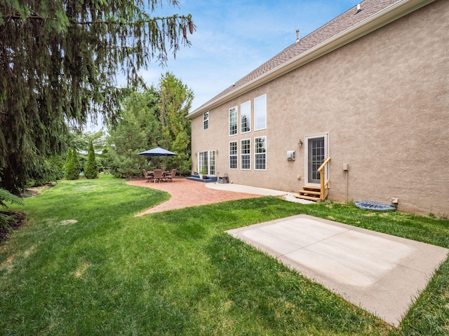 6165 Avocet Ct, Dublin, OH 43017 - view of green lawn featuring entry steps and a patio area