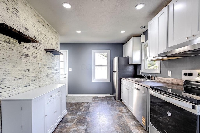 805 E Burgess St, Mount Vernon, OH 43050 - kitchen featuring stainless steel appliances, under cabinet range hood, recessed lighting, white cabinetry, and a textured ceiling