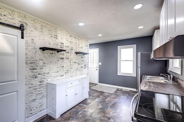 805 E Burgess St, Mount Vernon, OH 43050 - kitchen with electric range, ventilation hood, a textured ceiling, white cabinetry, and recessed lighting