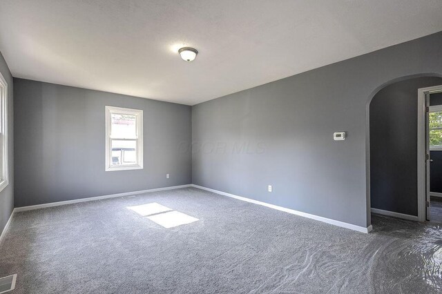805 E Burgess St, Mount Vernon, OH 43050 - unfurnished room featuring arched walkways and carpet flooring