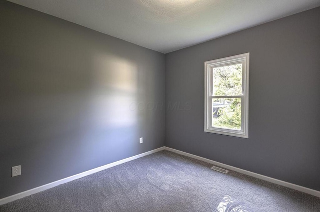 805 E Burgess St, Mount Vernon, OH 43050 - spare room featuring carpet floors and baseboards