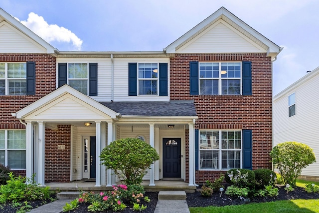 6166 Albany Crest Ave, New Albany, OH 43054 - view of front of house featuring brick siding and a porch