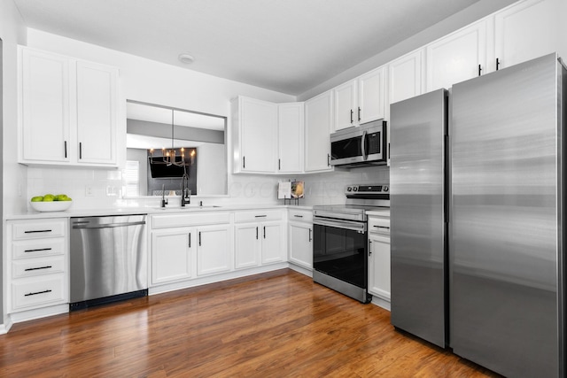 6166 Albany Crest Ave, New Albany, OH 43054 - kitchen featuring stainless steel appliances, light countertops, white cabinetry, and decorative backsplash