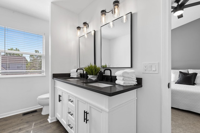 6166 Albany Crest Ave, New Albany, OH 43054 - ensuite bathroom featuring double vanity, wood finished floors, and a ceiling fan