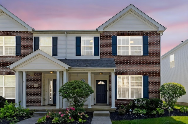 6166 Albany Crest Ave, New Albany, OH 43054 - view of front of house with brick siding and covered porch