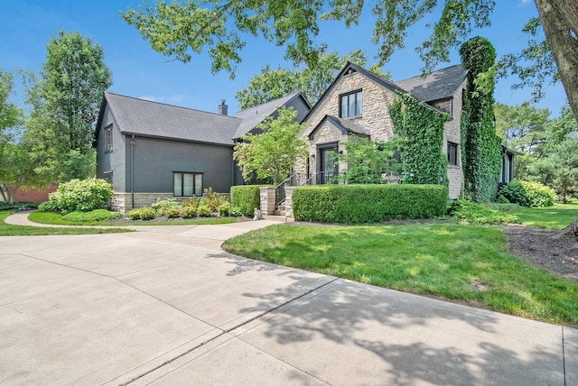 2946 Lewis Center Rd, Lewis Center, OH 43035 - view of front of house with stone siding and a front yard