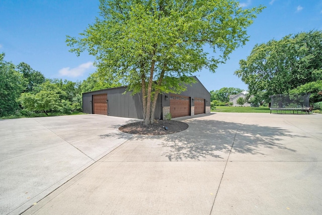 2946 Lewis Center Rd, Lewis Center, OH 43035 - detached garage with a trampoline