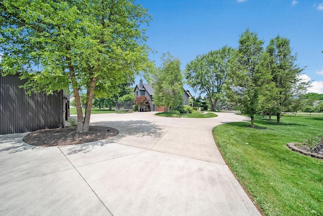 2946 Lewis Center Rd, Lewis Center, OH 43035 - view of home's community with curved driveway and a yard