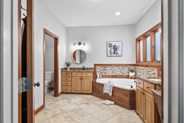 2946 Lewis Center Rd, Lewis Center, OH 43035 - full bathroom with vanity, a garden tub, and tile patterned floors