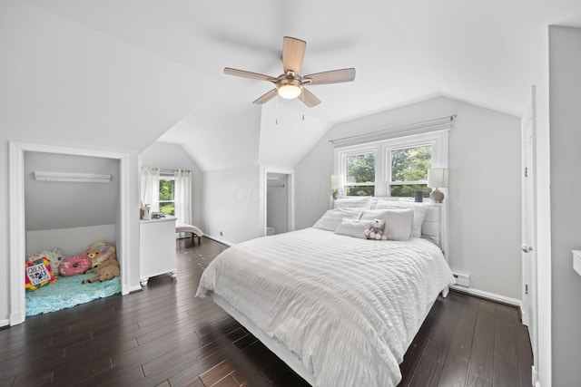 2946 Lewis Center Rd, Lewis Center, OH 43035 - bedroom featuring vaulted ceiling, dark wood-type flooring, ceiling fan, and a baseboard radiator