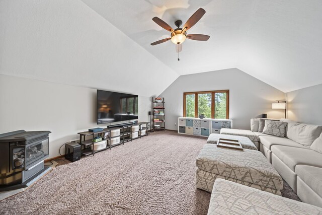 2946 Lewis Center Rd, Lewis Center, OH 43035 - living area with carpet, ceiling fan, vaulted ceiling, and a wood stove