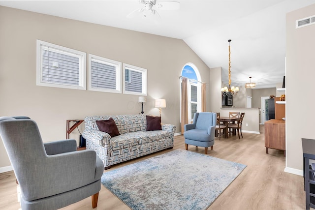 5442 Goose Falls Dr, Dublin, OH 43016 - living room featuring a ceiling fan, a chandelier, wood finished floors, and lofted ceiling