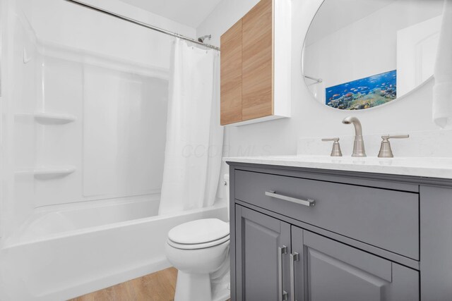 5442 Goose Falls Dr, Dublin, OH 43016 - full bathroom with vanity, shower / bath combo with shower curtain, and wood finished floors