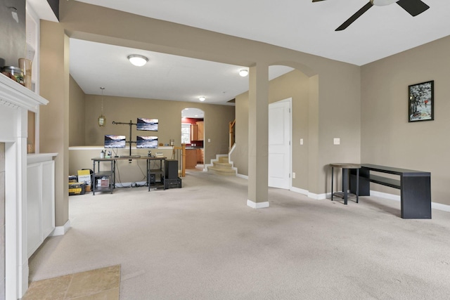 331 Hanton Way, Columbus, OH 43213 - living room featuring arched walkways, carpet flooring, a ceiling fan, and stairway