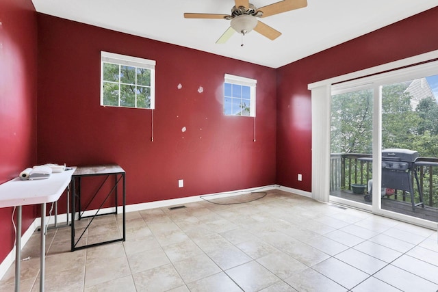 331 Hanton Way, Columbus, OH 43213 - tiled empty room featuring baseboards, a ceiling fan, and an accent wall