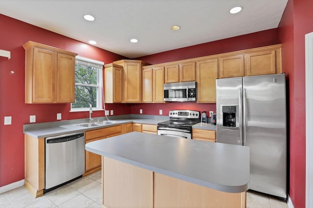 331 Hanton Way, Columbus, OH 43213 - kitchen with appliances with stainless steel finishes, a sink, recessed lighting, light tile patterned floors, and a kitchen island