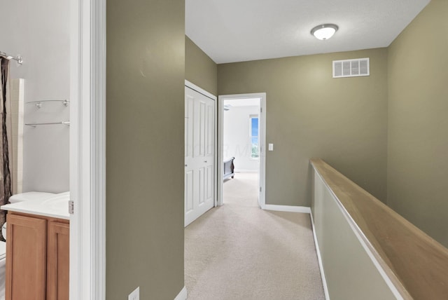 331 Hanton Way, Columbus, OH 43213 - hall with light colored carpet, an upstairs landing, and baseboards