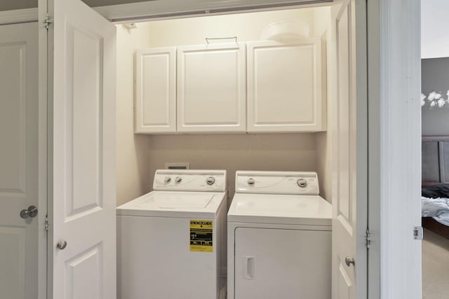 331 Hanton Way, Columbus, OH 43213 - washroom featuring cabinet space and separate washer and dryer