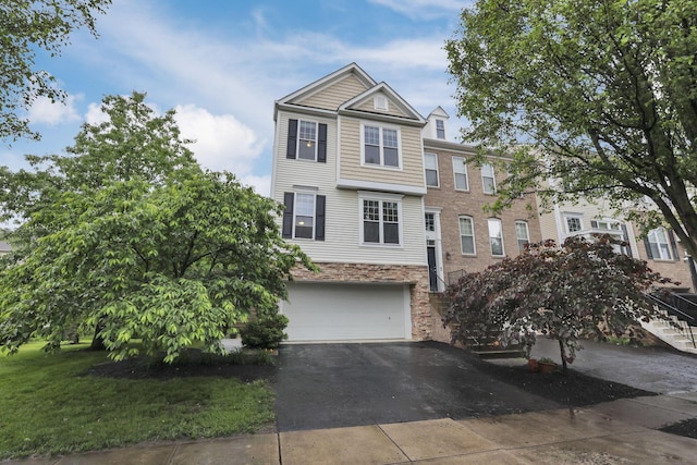 331 Hanton Way, Columbus, OH 43213 - multi unit property with a garage, driveway, stone siding, and stairway