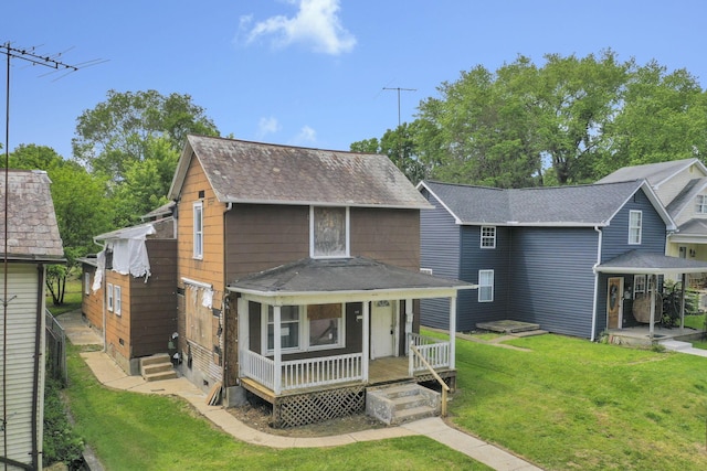 408 E Mulberry St, Lancaster, OH 43130 - view of front facade with a front lawn, a shingled roof, and covered porch