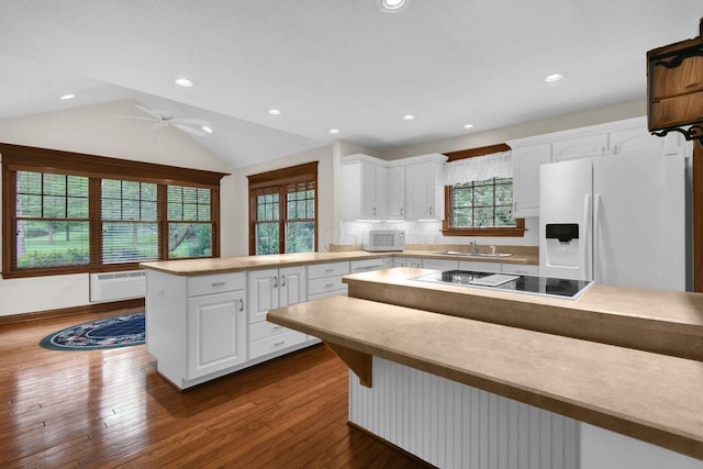 1366 Chapel Way, Heath, OH 43056 - kitchen with white appliances, white cabinets, dark wood-type flooring, recessed lighting, and a peninsula