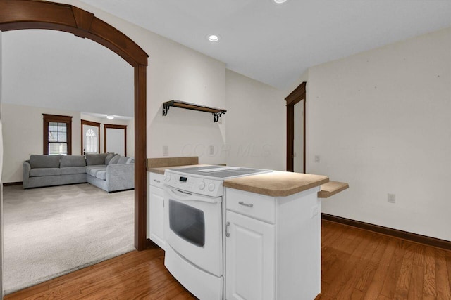1366 Chapel Way, Heath, OH 43056 - kitchen featuring electric range, white cabinets, light wood-style floors, recessed lighting, and a peninsula