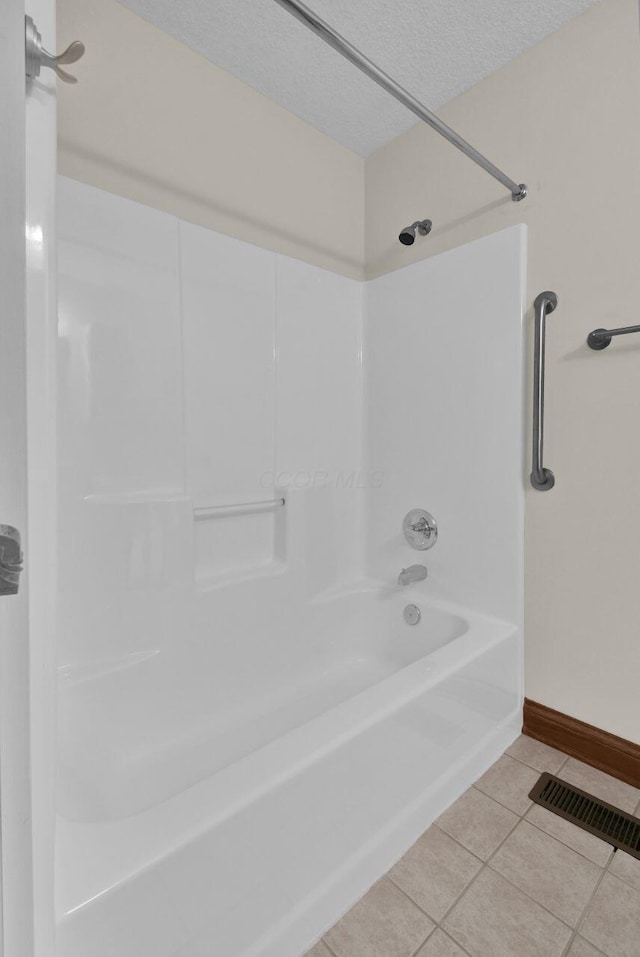 1366 Chapel Way, Heath, OH 43056 - full bathroom featuring tile patterned flooring, shower / bath combination, and a textured ceiling