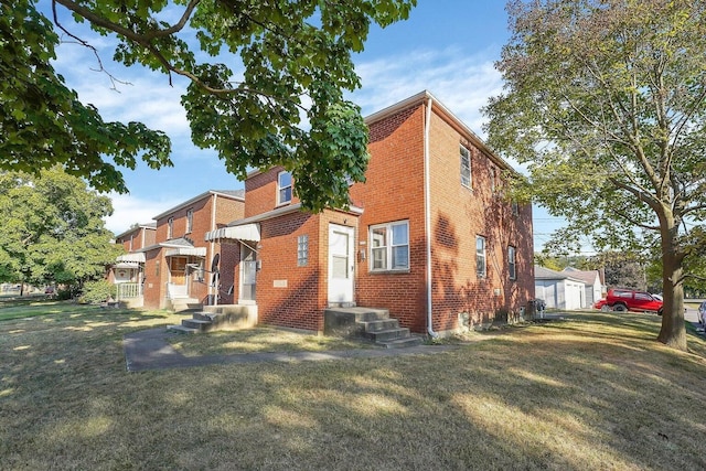 3276-3278 Sullivant Ave, Columbus, OH 43204 - view of front of home with brick siding and a front yard