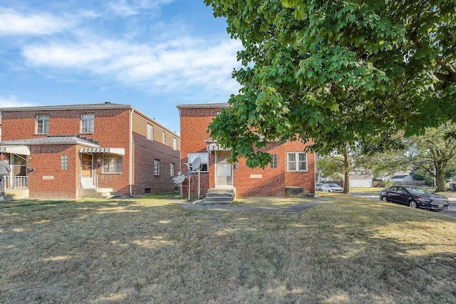 3276-3278 Sullivant Ave, Columbus, OH 43204 - view of front of house with brick siding and a front yard