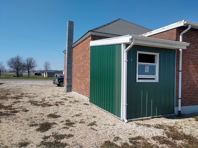 1125 Roberts Mill Rd, London, OH 43140 - view of side of property with brick siding and a chimney
