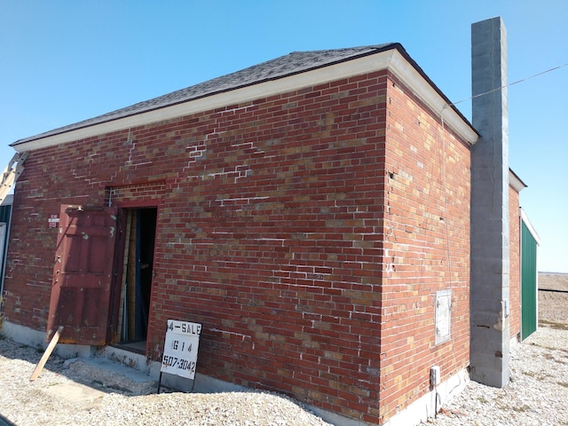 1125 Roberts Mill Rd, London, OH 43140 - view of side of home with brick siding and a chimney