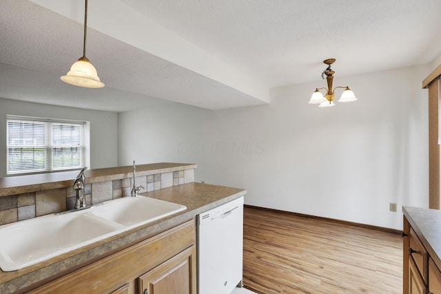 5062 Stoneybrook Blvd Unit 3F, Hilliard, OH 43026 - kitchen featuring dishwasher, light wood-type flooring, pendant lighting, and a chandelier