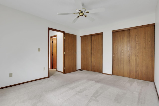 5062 Stoneybrook Blvd Unit 3F, Hilliard, OH 43026 - unfurnished bedroom with multiple closets, light carpet, and a ceiling fan