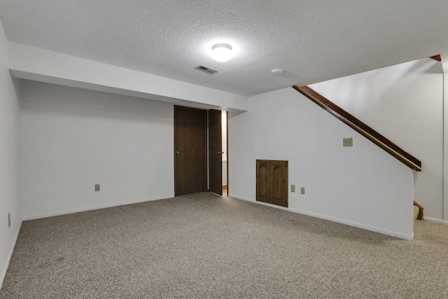 5062 Stoneybrook Blvd Unit 3F, Hilliard, OH 43026 - finished basement featuring a textured ceiling, carpet flooring, and stairs