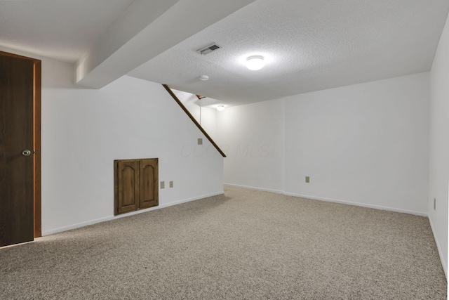 5062 Stoneybrook Blvd Unit 3F, Hilliard, OH 43026 - finished below grade area featuring carpet flooring, stairway, and a textured ceiling