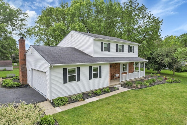 13680 Nantucket Ave NW, Pickerington, OH 43147 - traditional-style home featuring a porch, an attached garage, a front yard, driveway, and a shingled roof