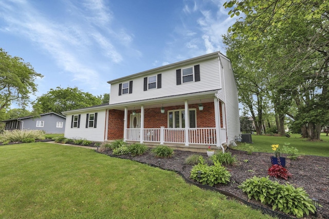 13680 Nantucket Ave NW, Pickerington, OH 43147 - traditional home with covered porch, a front lawn, brick siding, and central AC