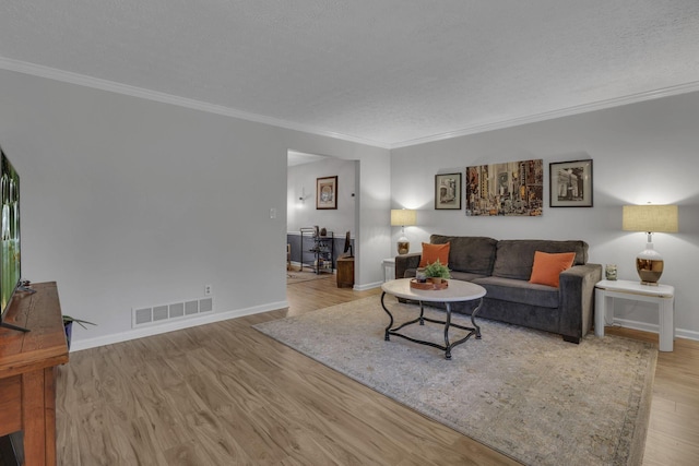 13680 Nantucket Ave NW, Pickerington, OH 43147 - living area with crown molding, wood finished floors, a textured ceiling, and baseboards
